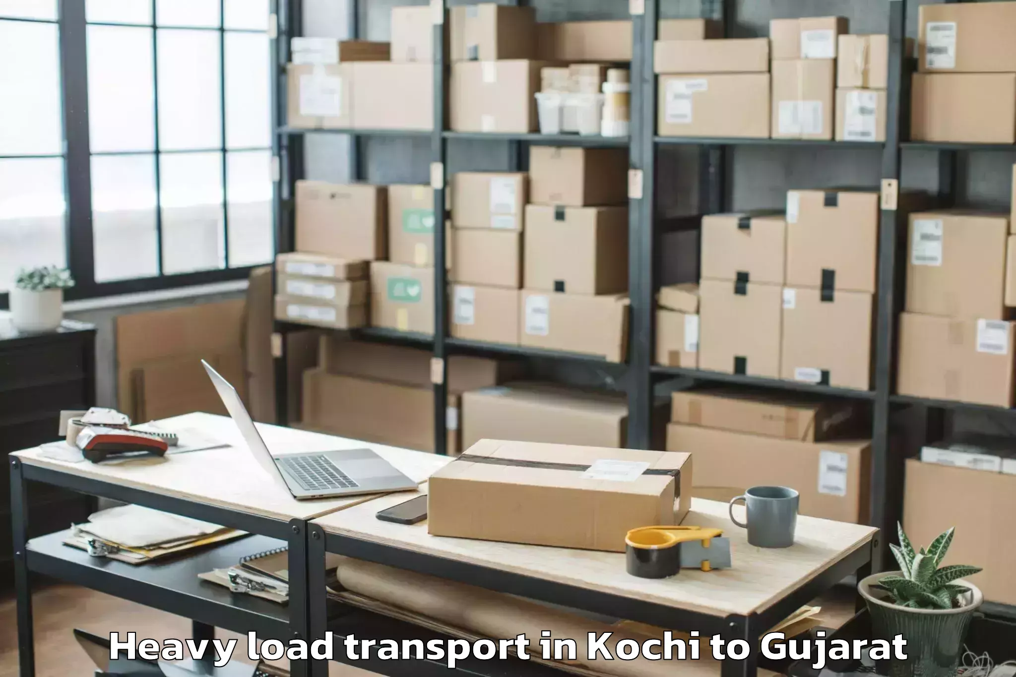 Affordable Kochi to Gls University Ahmedabad Heavy Load Transport